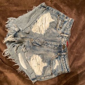 Torn denim shorts
